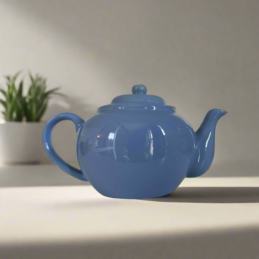 Baby blue teapot on counter 